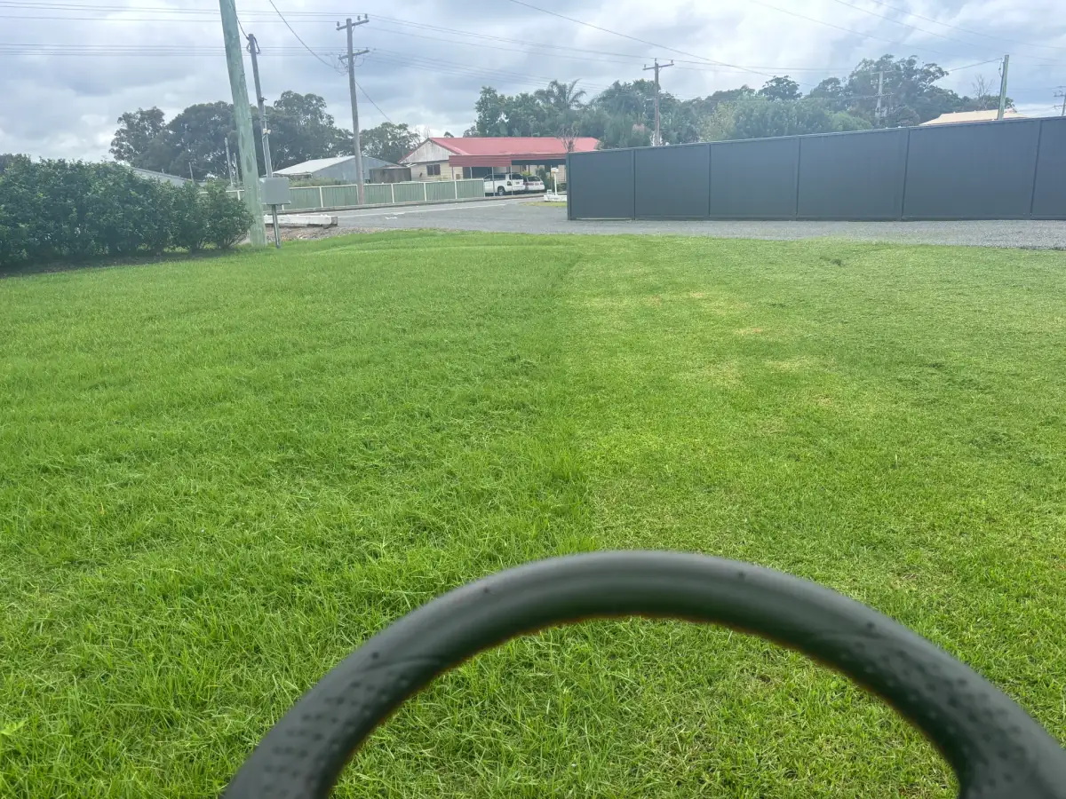 Cared-for lawn and garden beds with fresh mulch